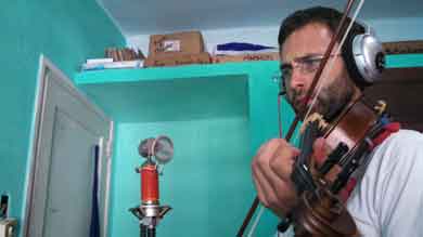 CLLAS graduate grantee Charlie Hankin, a music major, recorded violin tracks for raperos in Havana while carrying out ethnographic research.